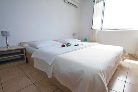 Beachfront Apartments Tamarix in Posedarje, Zadar County, Croatia, offers various modern, air-conditioned apartments with kitchen facilities, free Wi-Fi, and balconies or terraces with sea views. Located directly on the beach, the property provides e...